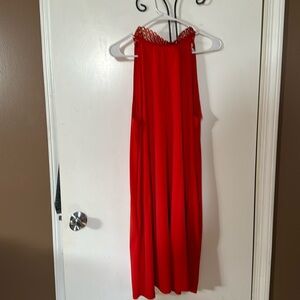 Red sleeveless midi dress with pockets.